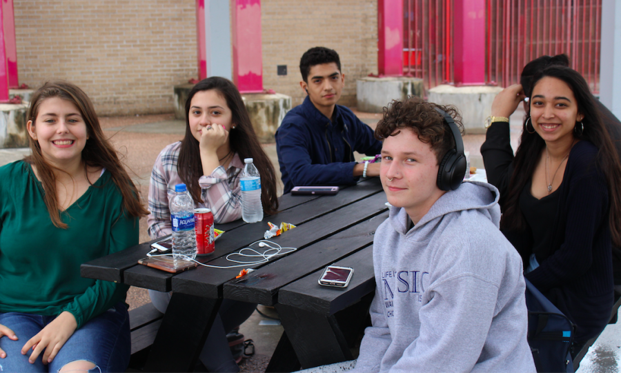 A group enjoys lunch on a rainy day.