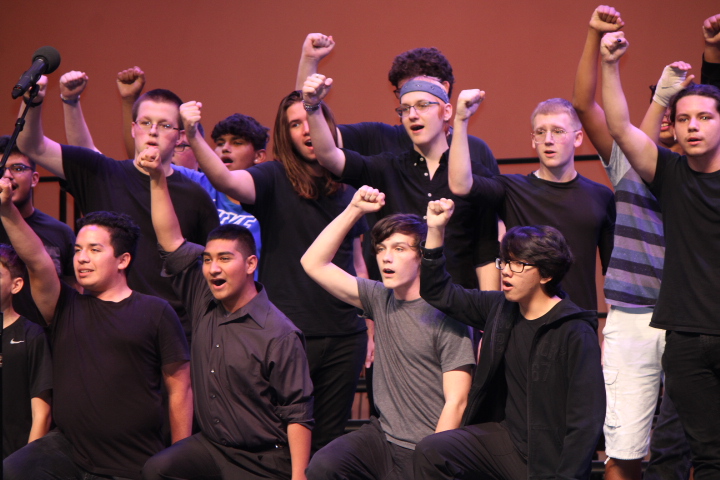 Combined treble/bass choirs give a heartwarming performance of Seize the Day from Newsies. 