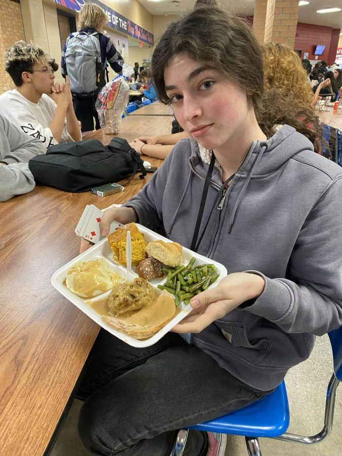 Xochi Wright, 11, with her Thanksgiving food. She was very excited for this very day, and was able to be 7th in line for the food.