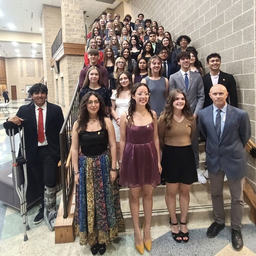 First picture of the new 2023-2024 NHS members and officers, with the 2022-2023 officers standing in front with sponser, Mr. Holcomb.