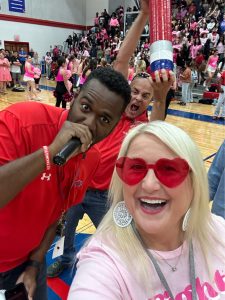 Coach Payne and Coach Duggan pose for an exciting picture during the class yells competition. 